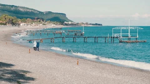 Romantic couple walking on beach Stock Footage 167380889