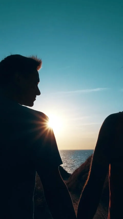 The romantic couple walking down to the sea shore. slow motion Stock Footage 242140890