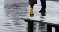 Romantic couple walking in the rain in a beautiful location. Secret of love HD Footage