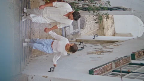 Romantic couple walking stairs up tiny street vertical. Happy pair enjoying date Stock Footage 277458014
