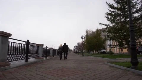 Romantic couple walking together. Video. An elderly couple walks in the city on Stock Footage 85143248