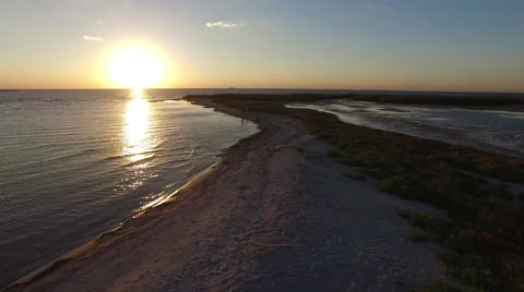 Romantic couple walks along the wild beach Stock Footage