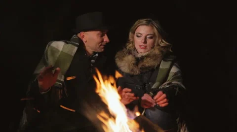 Romantic date around the campfire Stock Footage 68904131