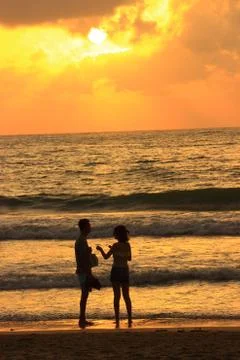 Romantic date on a background of sea sunset Stock Photos
