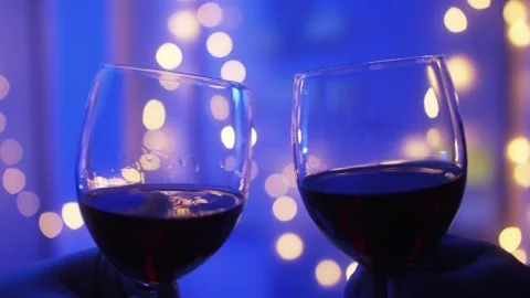 Romantic date dinner, couple drinking wine making cheers with glasses during Video stock 312446657