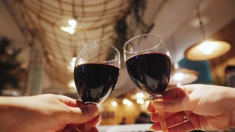 Romantic date dinner, couple drinking wine making cheers with glasses during Stock Footage 314109622