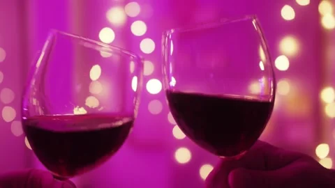 Romantic date dinner, couple drinking wine making cheers with glasses during Stock-Footage 314333191