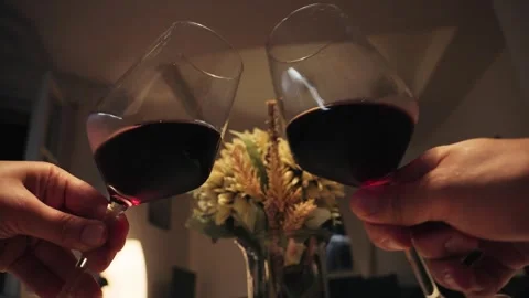 Romantic date dinner, couple drinking wine and making cheers with glasses during Stock Footage 328159931