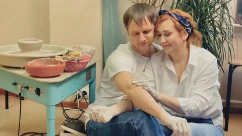 Romantic date for a generation X couple in love, in a pottery workshop. hands Stock Footage 179745941