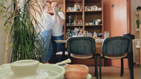 Romantic date for a generation X couple in love, in a pottery workshop. hands Stock Footage 179746190