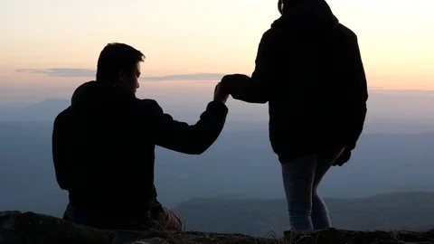 Romantic date of lovers at sunset on peak. Stock Footage 126360004