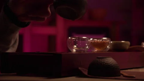 A romantic date in a secluded quiet tea room. A man pours natural chinese tea Stock Footage 145531120