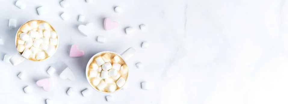 Romantic desk top with two cups of coffee with marshmallows on marble table. Top Stock Photos