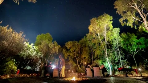 Romantic dinner in Australian outback under stars Stockbeeldmateriaal 137998419