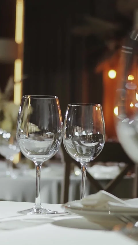 A romantic dinner in an elegant restaurant with candlelight and wine.Wedding Stock-Footage 308396241