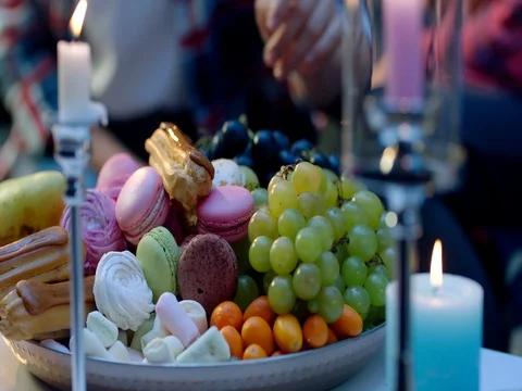 Romantic dinner, grapes of sweets and candles Video stock 83277439