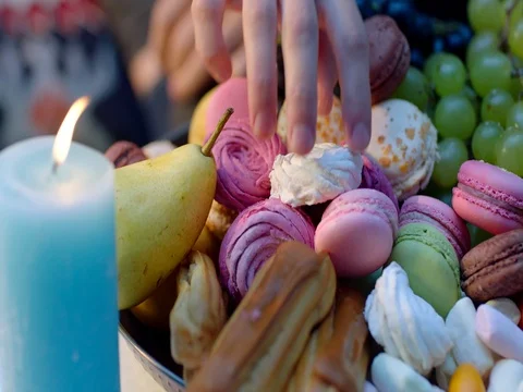 Romantic dinner, grapes of sweets and candles Stock Footage 83278905