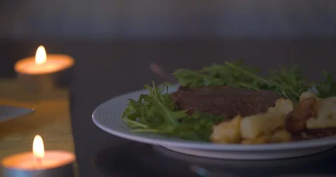 Romantic Dinner Lit by Candles Stock Footage 101375181