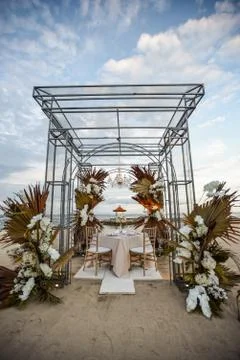 Romantic dinner setting on the beach Stock Photos