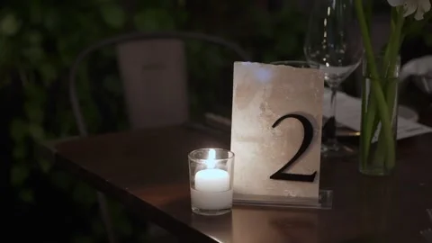 Romantic Dinner Setting, Serene Dinner Scene Illuminated By Flickering Candles Video stock 323771292