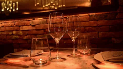 Romantic dinner table setting in a luxury restaurant Stock Footage 327581870