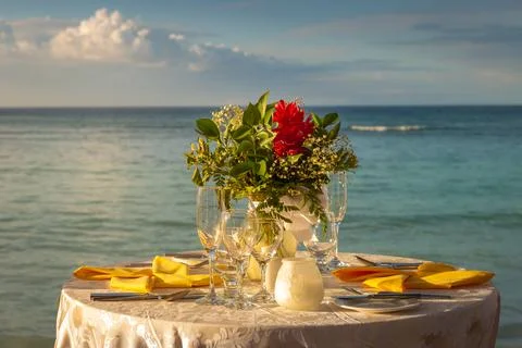 Romantic dinner: table for two and Beach Montego Bay - Jamaica Stock Photos