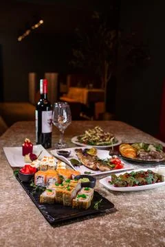 Romantic dinner of various dishes on the table in the restaurant Stock Photos
