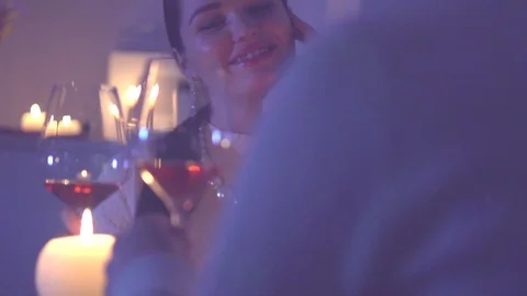 Romantic dinner. Young couple toasting wine glass in restaurant or at home Stock Footage 101912043