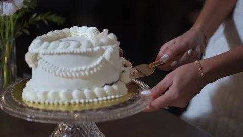 Romantic Duo Holding Hands While Cutting Beautifully Decorated Wedding Cake Video stock 323772810