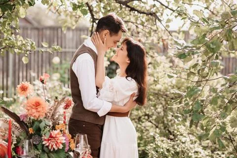 Romantic embrace of two lovers man and woman in the open air Stock Photos