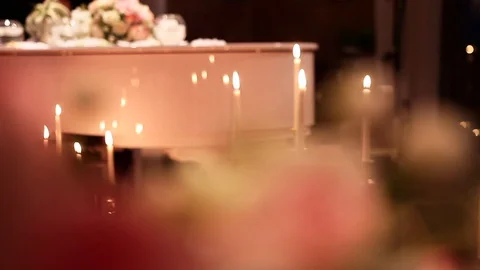 Romantic evening with burning candles, live music and flowers for valentines day Stock Footage 129972489