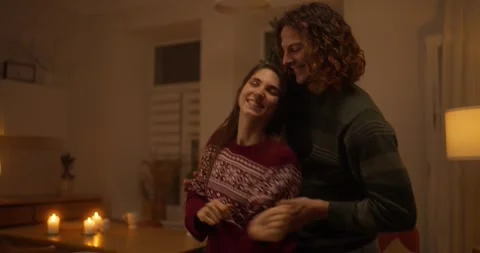 Romantic evening dance by the Christmas tree in a cozy living room Stock Footage 318040289