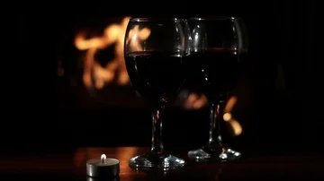 Romantic evening with a fireplace and wine for two Stock Footage 85717815