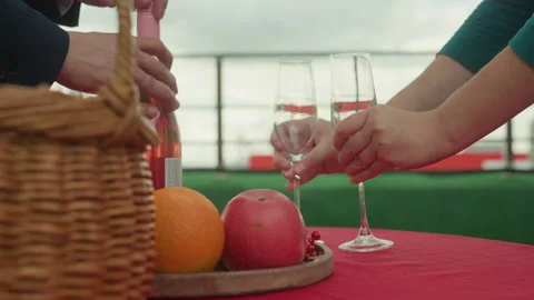 Romantic evening shared, Couple enjoys wine on rooftop, Evening picnic with Stock Footage 325216439