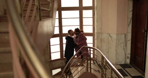 Romantic farewell of lovers on the steps of an old apartment building Stock Footage 247282177