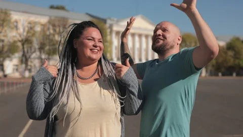 Romantic fat couple dancing and embracing together at street outdoor Stock Footage 136545139