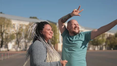 Romantic fat couple dancing and embracing together at street outdoor Stock Footage 137850575