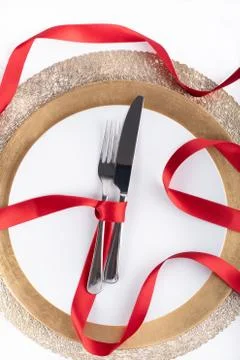 Romantic festive dinner with white empty plate with cutlery Stock Photos