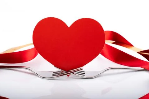 Romantic festive dinner with white empty plate with cutlery Foto stock