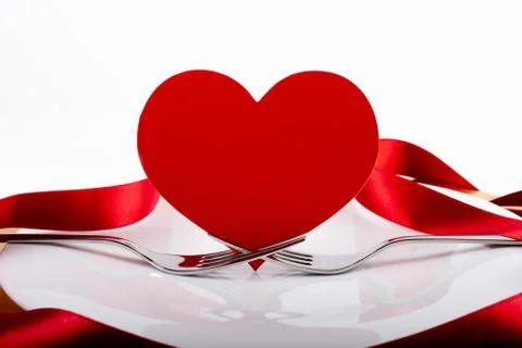 Romantic festive dinner with white empty plate with cutlery Stock Photos