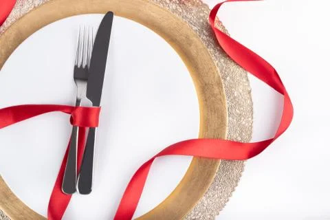 Romantic festive dinner with white empty plate with cutlery Stock Photos