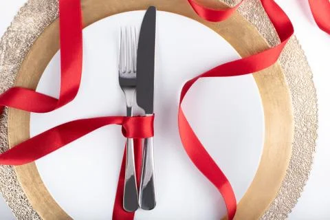 Romantic festive dinner with white empty plate with cutlery Stock Photos