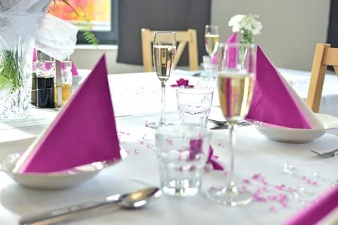 Romantic festive wedding table set in pink color Stock Photos