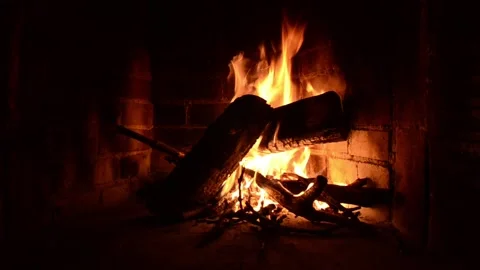 Romantic Fire in fireplace with logs and flames at home. Flames of burning wood Stock Footage 131987299
