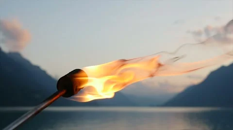 Romantic fire torch light burning at twilight sky 库存影片 64802276