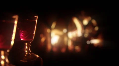 Romantic fireplace with two wine filled glasses. Zoom in. Stock Footage 44558384