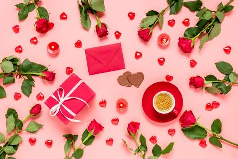 Romantic flat lay composition for Valentine's day. Red roses, hearts, coffee cup Stock Photos