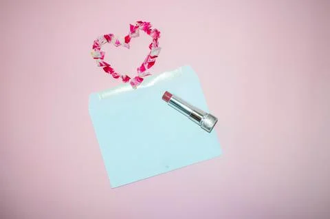 Romantic Flat Lay with Envelope, Lipstick, and Petal Heart Stock Photos