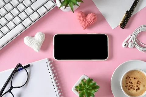 Romantic Flat lay, top view. Background with smartphone, keyboard, stationery Stock Photos