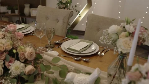 Romantic floral table setting with fine dining decor and soft lighting Stock Footage 312208078